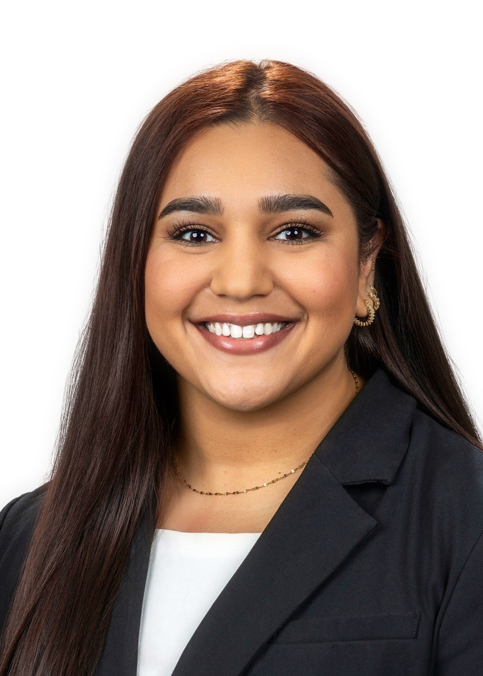 Our Staff: Professional headshot of Nikita Samra, smiling with dark hair. Confident team member portrait.